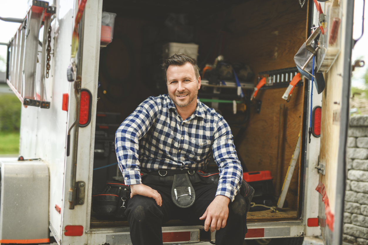 Blog - iStock 2235912927 handyman in his van before a job